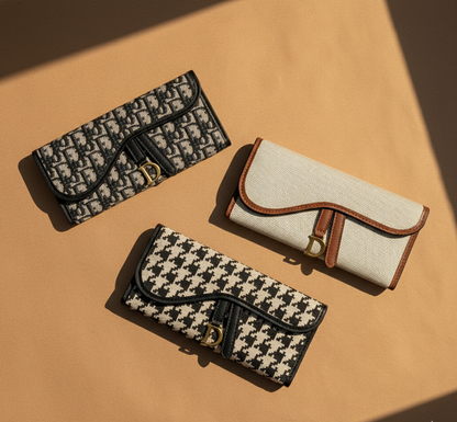 Three patterned wallets on a beige surface
